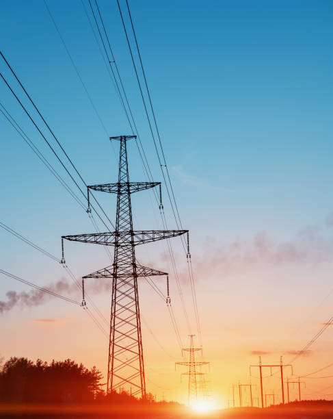 istock sunset under the high-voltage tower in the background. 807463512