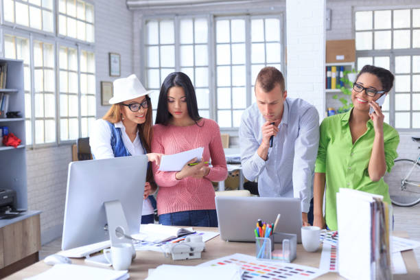 istock Team of young people in modern office 807464182