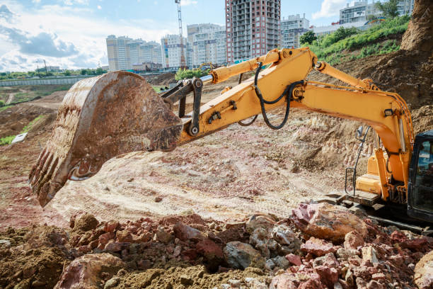 istock Excavator work on the construction site. The bucket lifted up. 807470830