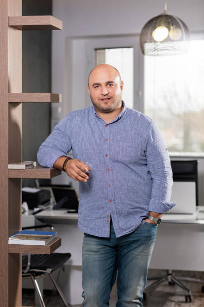 istock Young businessman posing in office. 807486764