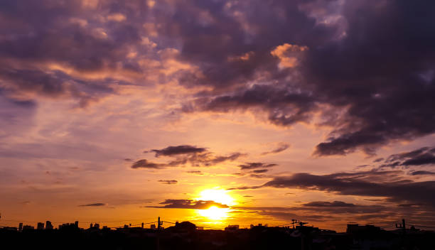 istock Raising sun, sunset with cloudy sky, yellow, orange, blue color sunlight 807497928