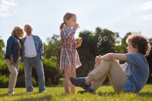 istock Pretty little girl making bubbles 807501372