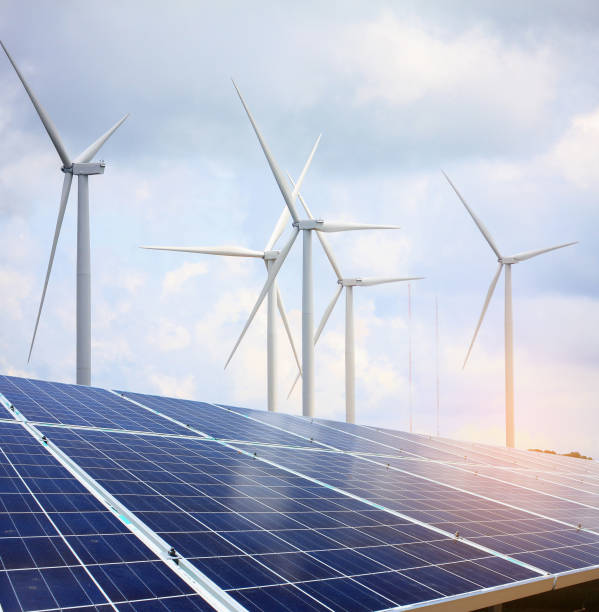 istock solar panels and wind turbines with the clouds and sky 807509426