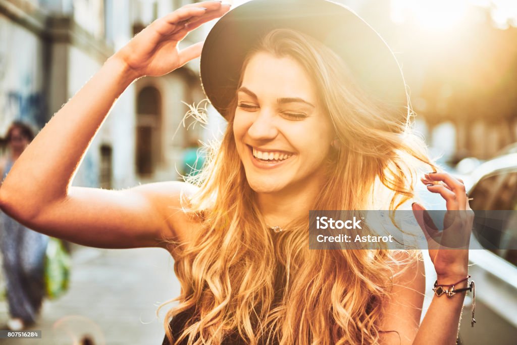 Portrait Portrait of young woman with hat smiling Women Stock Photo