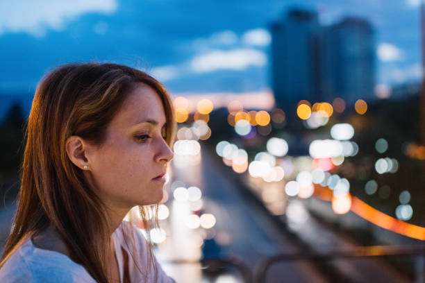 istock Depressed woman in the city 807520862