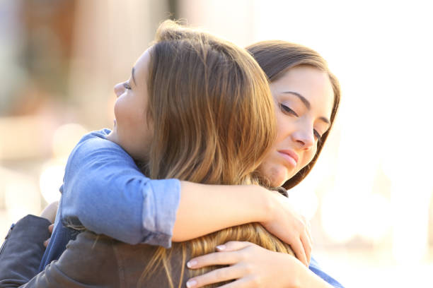 istock Hypocritical girl embracing a friend 807529824