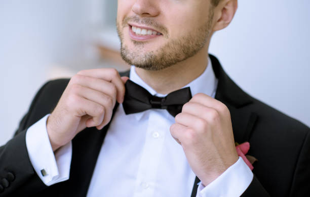 istock Handsome groom in suit in the nature 807530360