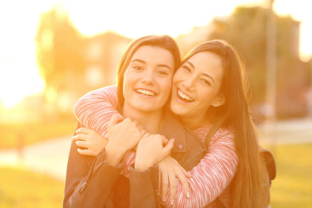 istock Two happy friends looking at you 807530822