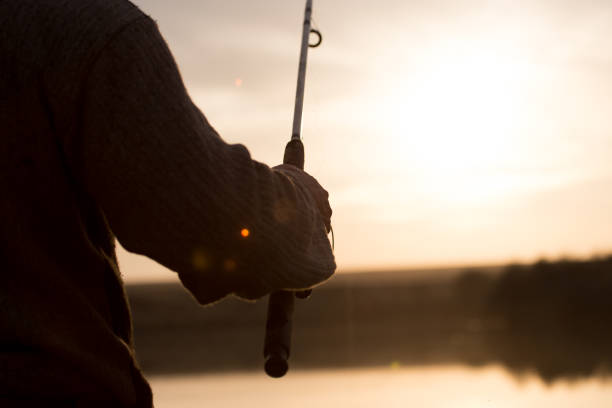 istock rod on the lake at sunset 807533630