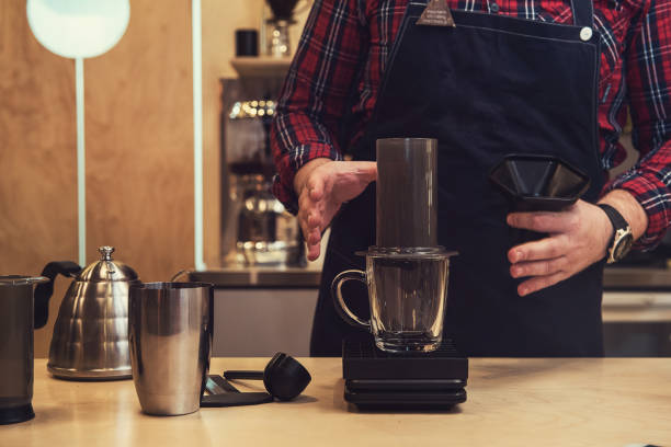 istock Barista brewing aeropress coffee 807541242