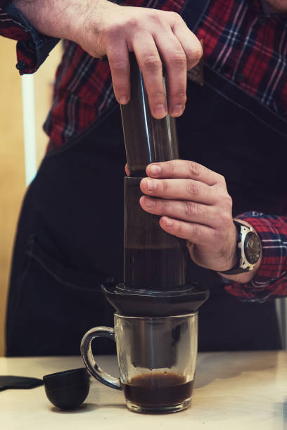 istock Barista brewing aeropress coffee 807541766