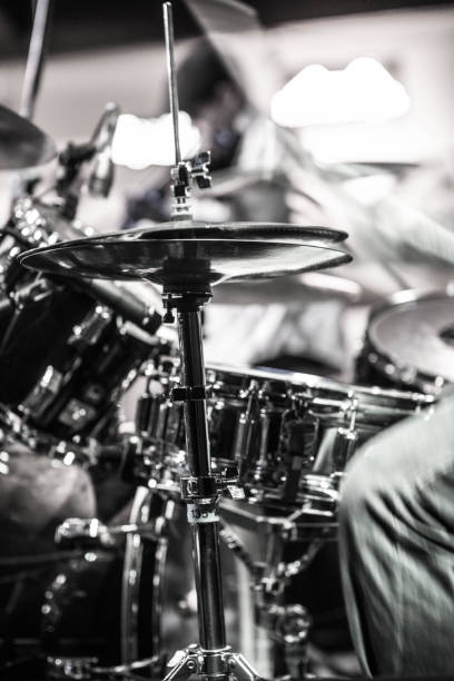 Drummer drum playing black and white blurred vertical shot Drummer drum playing black and white blurred vertical shot bass drum photos stock pictures, royalty-free photos & images
