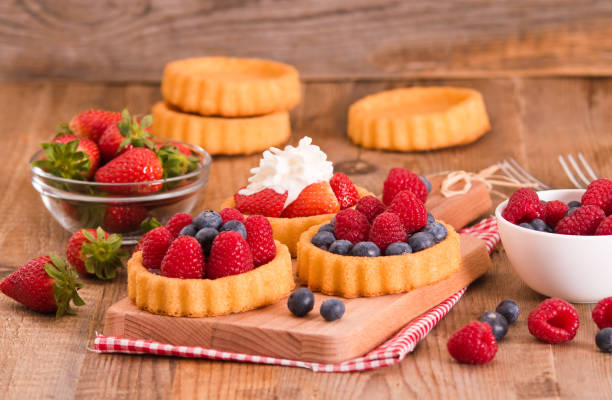 istock Tartlets with forest fruits. 807573436