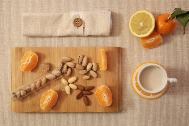 istock Food Backgrounds - breakfast with citrus and peanuts 807575938
