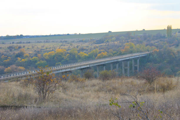 istock Bridge across the river Southern Bug in Ukraine on autumn 807579722