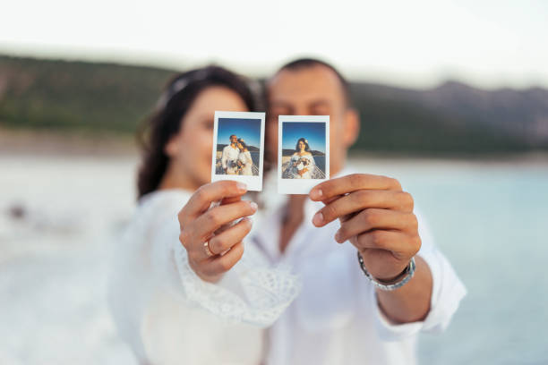 istock Happy couple showing instant selfie 807597034