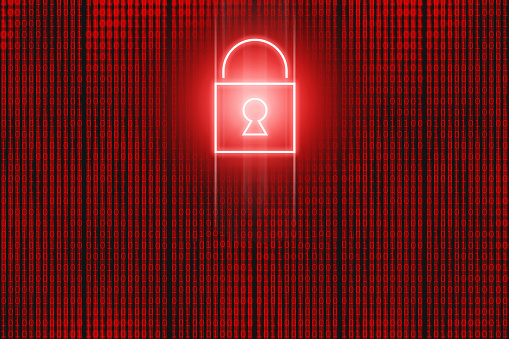 Red neon locked padlock icon in front of binary code screen. Hacking background concept