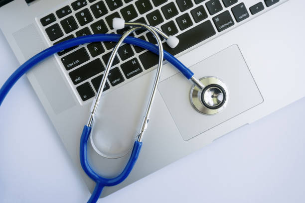 istock Stethoscope Lying on Top of Laptop 807714084