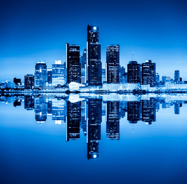 istock Detroit skyline reflected in water during sunset 807725482