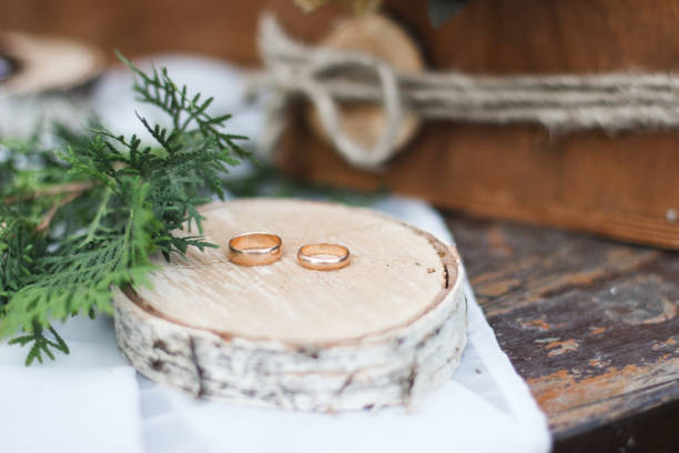 istock Wedding ring on a piece of wood. forest mirror 807736796