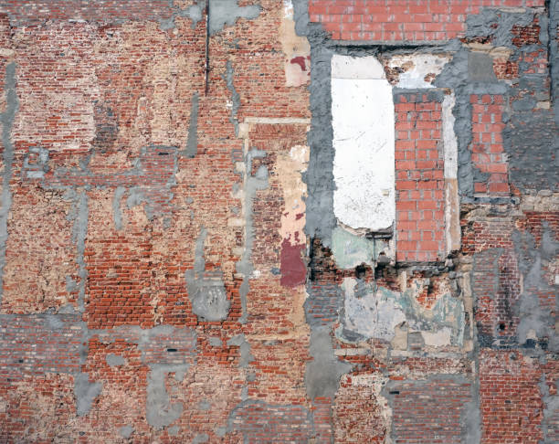 istock part of old derelict brick wall with several different bricks and cement patches 807745194