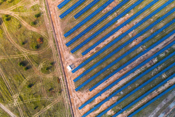 istock Solar panels placed on a countryside meadow. 807747884
