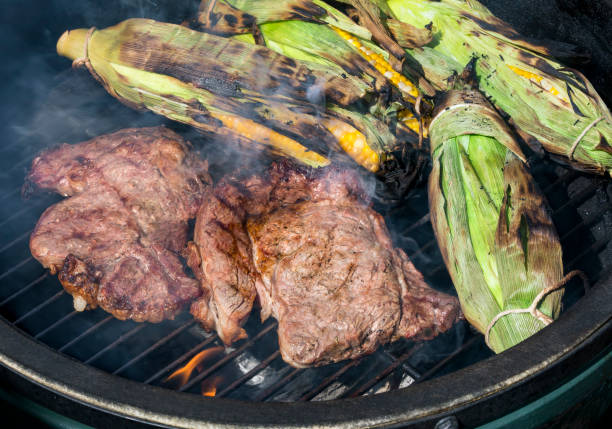 istock Steaks and Roasting Ears on the Grill 807756720