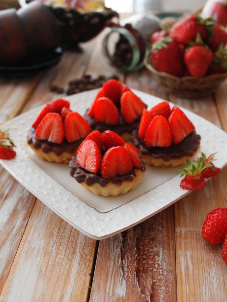 istock Cheese tartlets with chocolate and sweet strawberry dessert 807770592