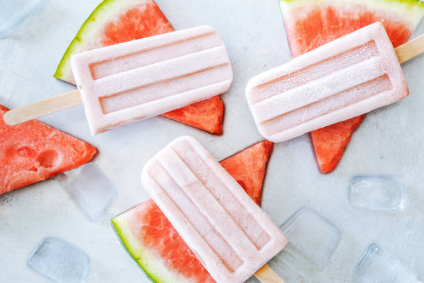 istock Watermelon popsicles on gray background. Refreshing summer dessert. 807775478