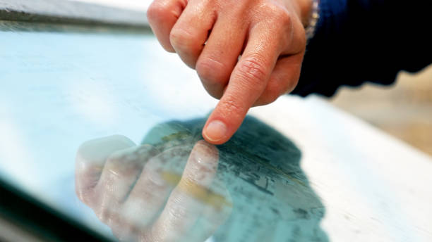 istock Hands forefingers pointing places on touristic map 807800330