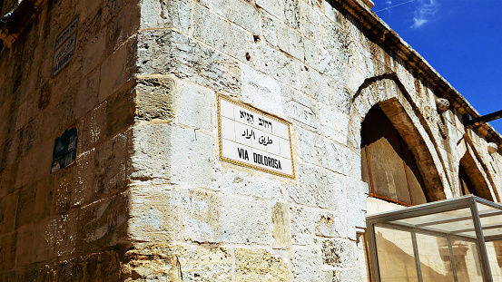 Via Dolorosa street sign in Jerusalem old city. Via Dolorosa is a sacred place for the all Christians in the world. Located in Holy land Jerusalem. Zoom shot.