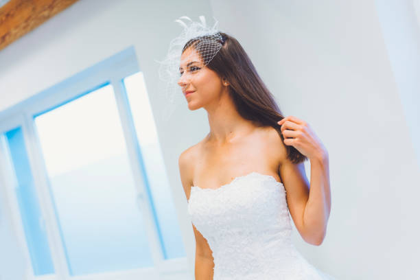 istock Breathtaking bride to be in white designer dress 807822374