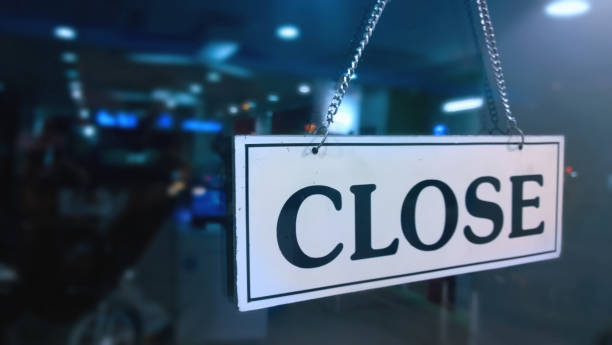 Closed sign board hanging outside store