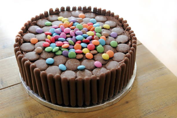 istock Chocolate cake covered in chocolate fingers, chocolate buttons and chocolate beans 807828376
