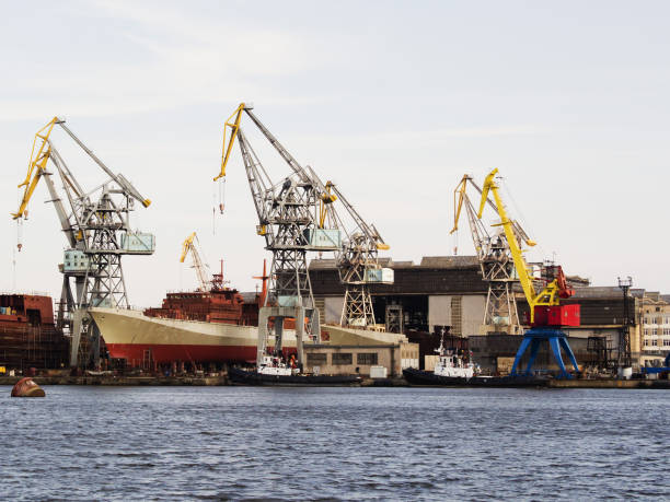 istock Big ship under repairing on floating dry dock in shipyard 807828556