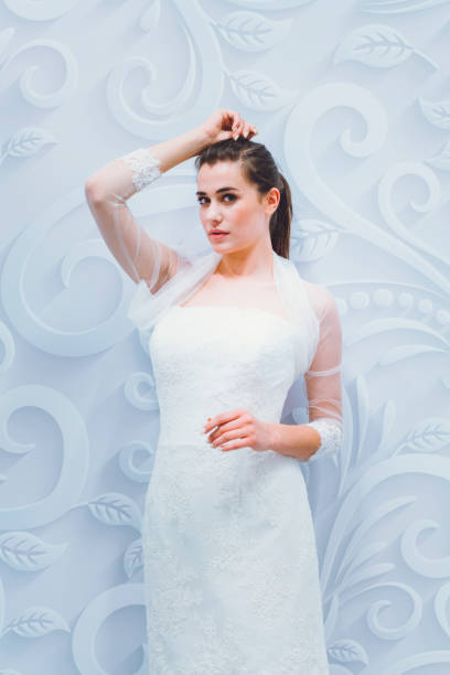 istock Breathtaking bride to be in white designer dress 807829706