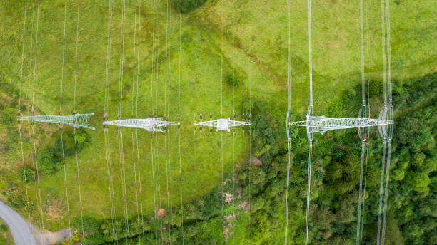 istock Electricity pylons - aerial view 807836912