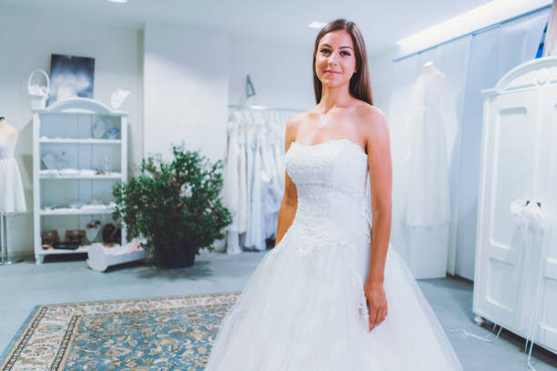 istock Breathtaking bride to be in white designer dress 807837630