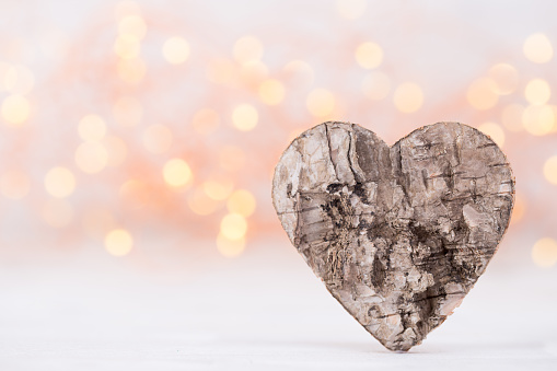 The wood Heart shapes on abstract light  background in love concept for valentines day.