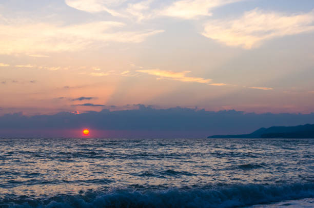 istock Amazing sea sunset, the sun, waves, clouds 807844998