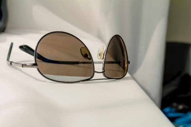 istock Black man sunglasses on white cloth background 807848050