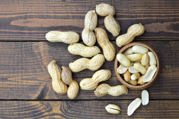 istock Top view of peanuts in the bowl 807870106