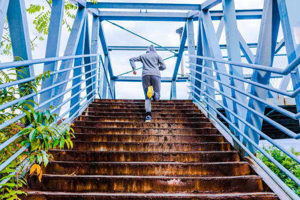 getting fit one step at a time - running athlete staircase teenager imagens e fotografias de stock