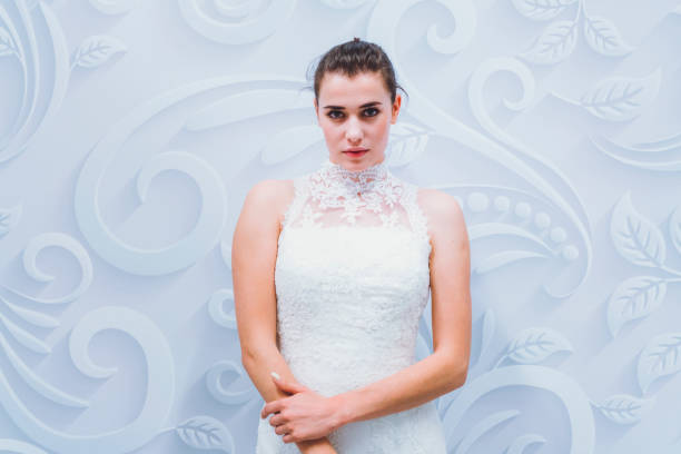 istock Fashion model posing in white dress 807897668