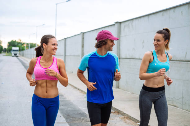 istock Group of young people jogging 807897900