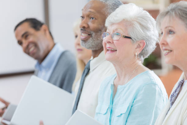istock Group of seniors attend retirement planning seminar 807900288