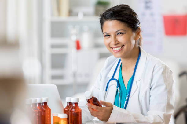 istock Doctor or pharmacist reviews patient's prescriptions 807902438