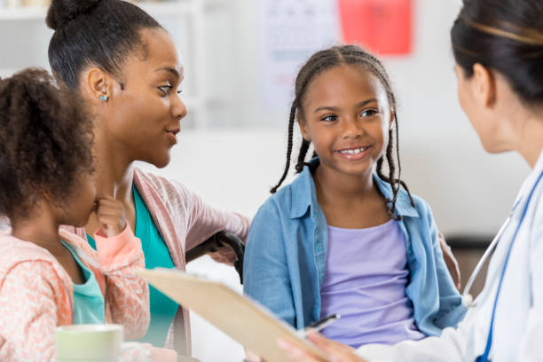 istock Attentive young patient listens to her doctor 807902994