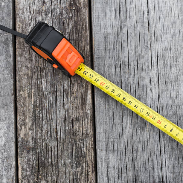 istock Measuring tape on a wooden board 807909816