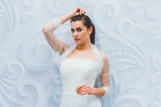 Fashion model posing in white dress